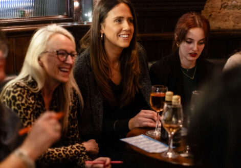 3 girls laughing and playing bingo at The Half Crown in Hackney